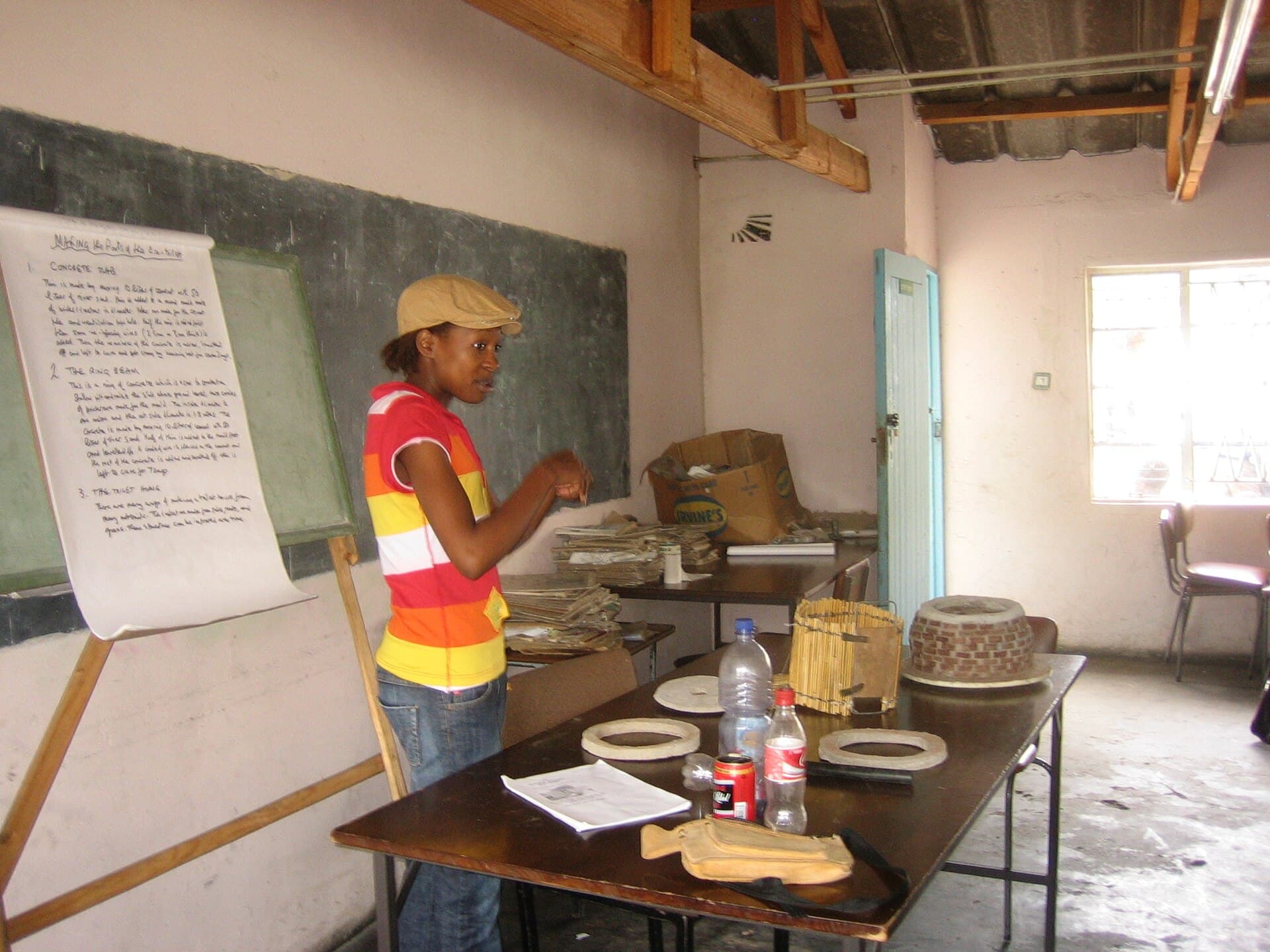 A community training session using flip charts and models at a Zimbabwean school